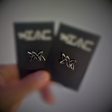 DNA Strand lapel pin displayed on branded IAC Lyfestyle backing cards, showing polished metal finish and signature DNA logo.