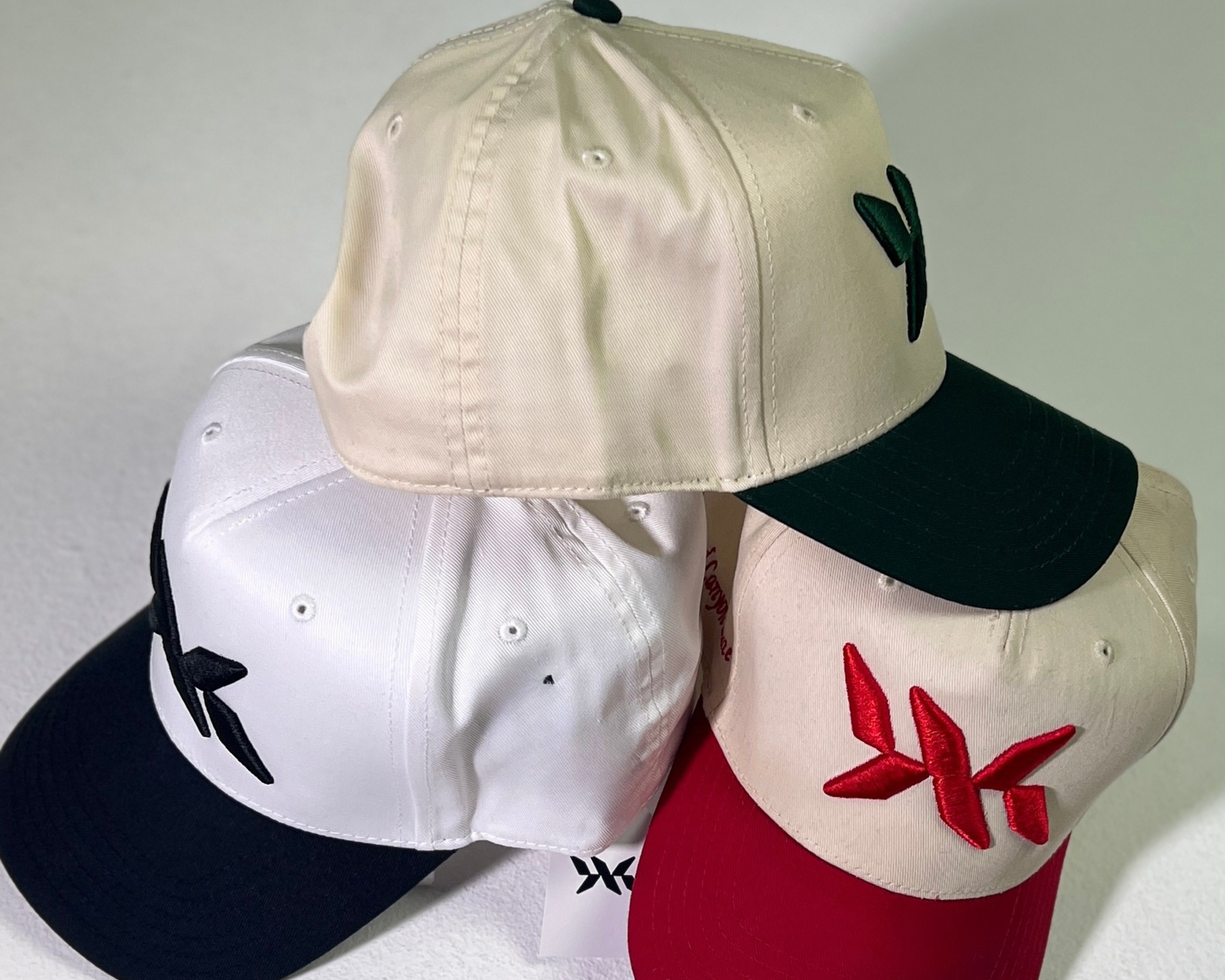 Multiple DNA Strand snapback hats displayed together, showcasing different colorways from IAC Lyfestyle.
