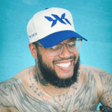 Model wearing cream and royal blue DNA Strand snapback by IAC Lyfestyle