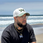 DNA Strand snapback hat worn outdoors, highlighting fit and style from the IAC Lyfestyle snapback bundle. Ocean in the background