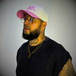 Model wearing a pink and cream DNA Strand snapback hat from the IAC Lyfestyle snapback bundle.