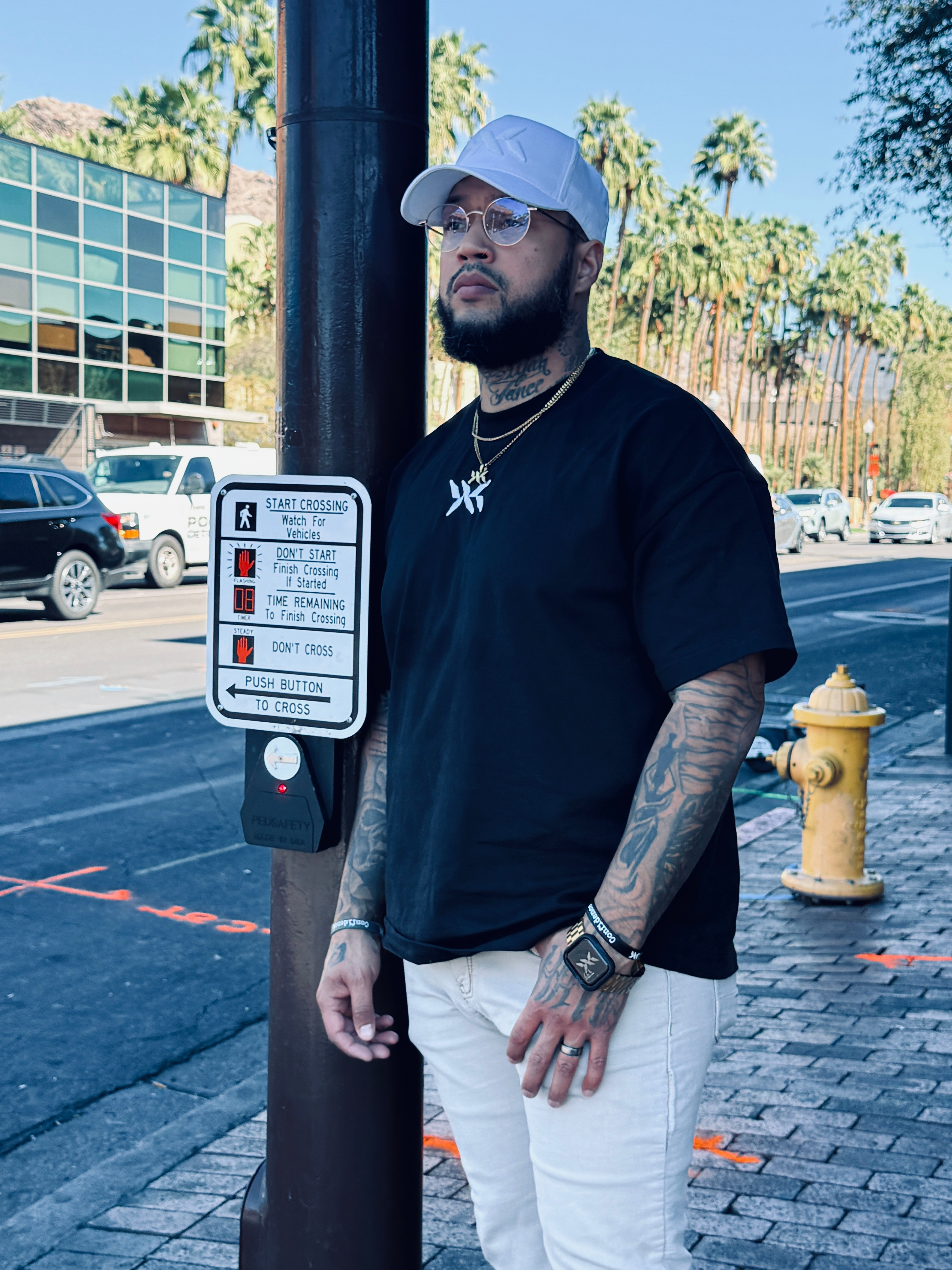 Model wearing black DNA Strand Logo oversized t-shirt by IAC Lyfestyle